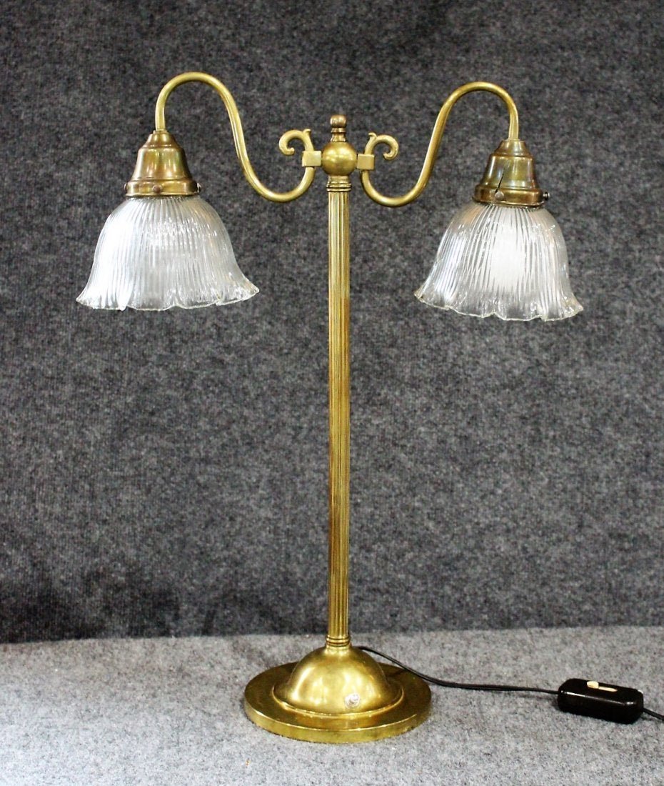 Brass 2-Light Piano Lamp with Clear Holophane Shades: Brass 2-Light Piano Lamp with Clear Holophane Ribbed Glass Shades. Wiring good, working. Size: 23.5 in. height, 18 in. wide, 6 in. diameter shades, 7 in. diameter base.