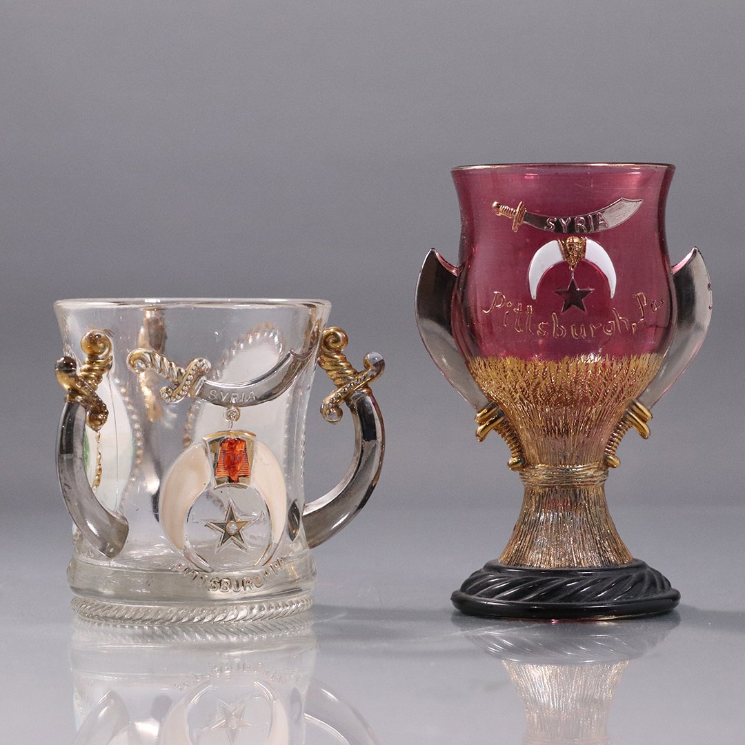 [2] Two Syria 3-Handle Goblets All Embossed: [2] Two Syria 3-Handle Goblets All Embossed. Size: 3,5 in. height x 4 in. wide and 5.25 in. height x 3.5 in. wide.