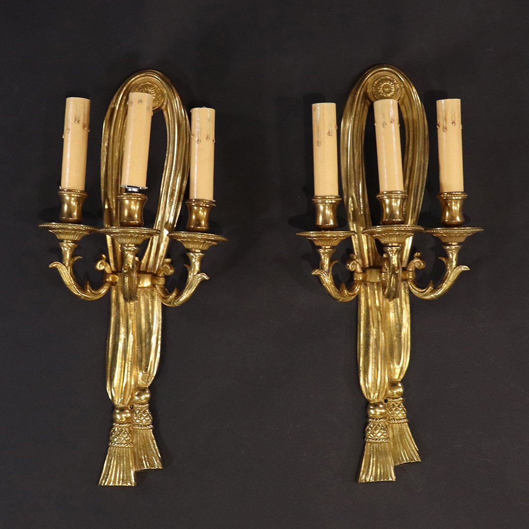 2 Quality French Empire Style Brass Tassel Wall Sconces: 2 Quality French Empire Style Brass Tassel Wall Sconces. Each 3 Light, Electric. Size: 18 in. length, 8 in. wide