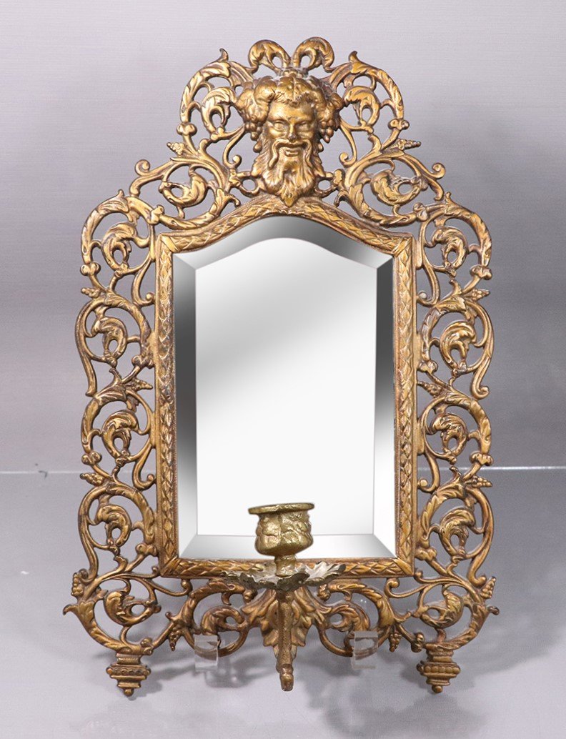 Bradley & Hubbard Mirror Wall Sconce Bacchus Face Crest: Bradley & Hubbard Mirror Wall Sconce Bacchus Face Crest. Signed B & H [Bradley and Hubbard], numbered 3504 & 3509. Beveled mirror, single candle sconce. Size: 15 in. length, 10 in. wide.