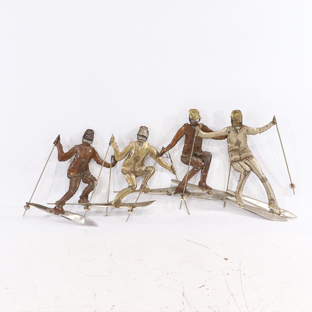 Mid-Century Four Skiers Metal Cutout Wall Hanging: Mid-Century Four Skiers Metal Cutout Wall Hanging. size: 16h x 38w