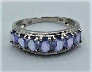 10 K White Gold Ring Row of 7 Oval Tanzanite Stones: 10 K White Gold Ring Row of 7 Oval Tanzanite Stones. Marked: 10K ; Ring Size: 6.25