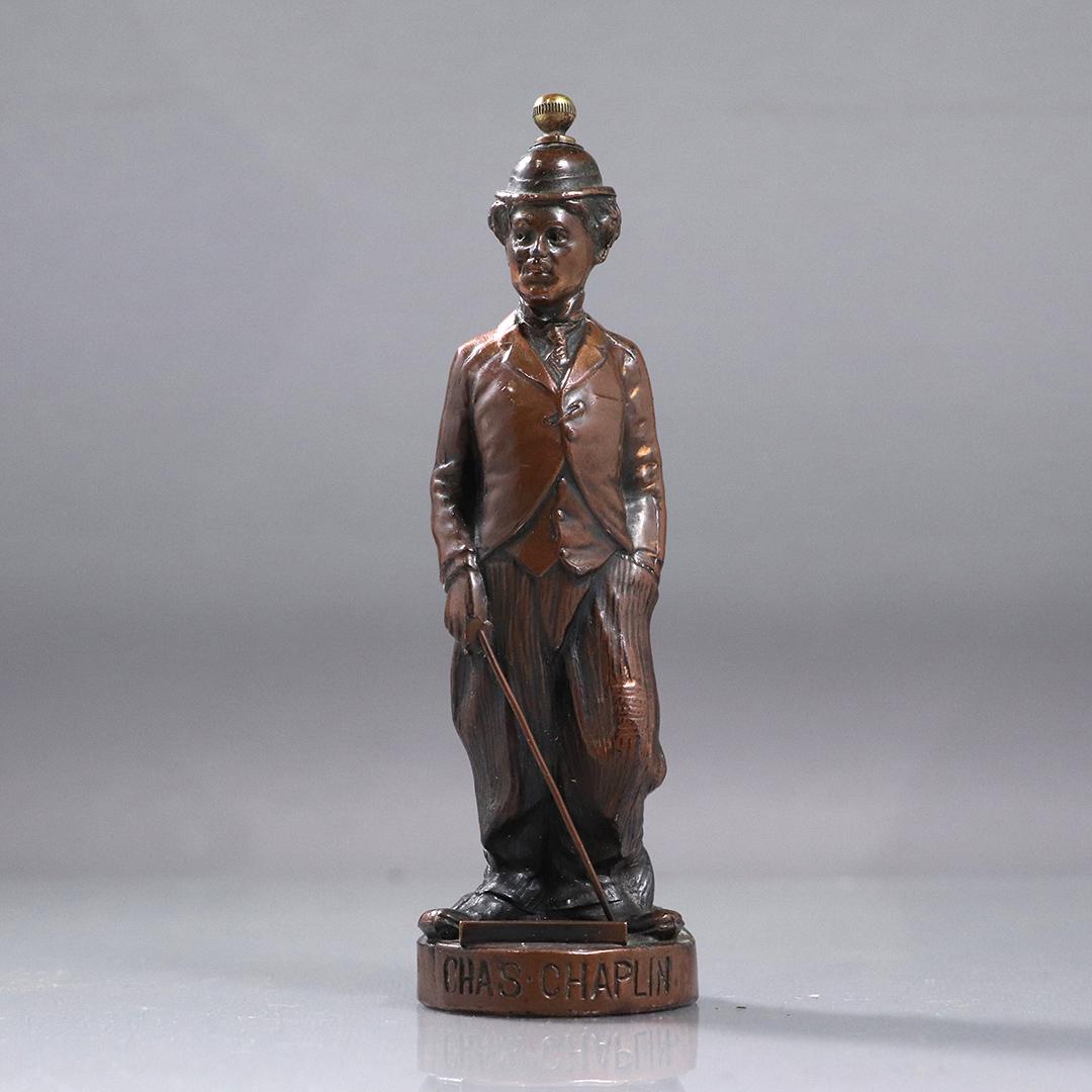 Charlie Chaplin Bronze Clad Disinfectant Figure Bottle: Charlie Chaplin Bronze Clad Disinfectant Figure Bottle. Antique. On front: CHAS CHAPLIN, on back: Compliment G E SENG Jr, Disinfectant, Atlanta Ga. Unique Item, Good original patina finish. size: 6.5h