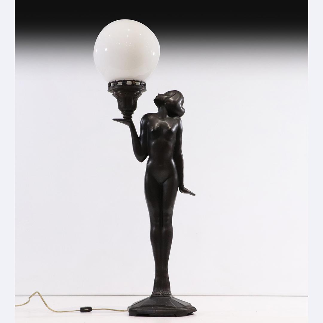 Metal Art Deco Standing Nude Holding Ball Shade Lamp: Metal Art Deco Standing Nude Holding Ball Shade Lamp. Signed: L&L WMC on base. Good dark bronze patina finish on cast white metal. size: 34h x 10w