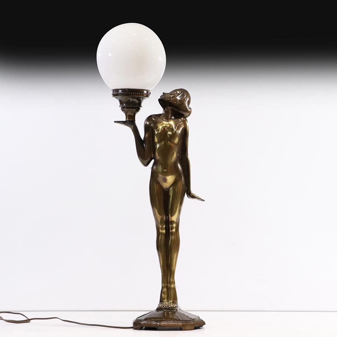Metal Art Deco Standing Nude Holding Ball Shade Lamp: Metal Art Deco Standing Nude Holding Ball Shade Lamp. Signed: L&L WMC on base. Good bronze patina finish on cast white metal. size: 33h x 10w