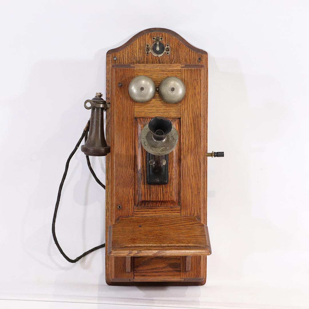 The Sumter Telephone Antique Oak Case Wall Mount Phone: The Sumter Telephone Antique Oak Case Wall Mount Phone. Plaque reads: The Sumter Telephone Manf'g Company, Sumter SC, USA size: 25h x 10w x 13d