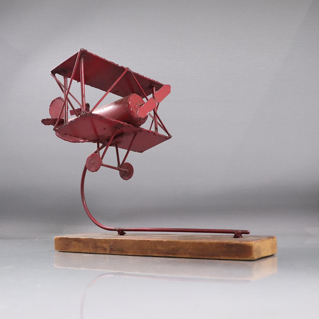 Welded Metal Sculpture of Red Baron Airplane, Wood Base: Welded Metal Sculpture of Red Baron Airplane, Wood Base. size: 9.25h x 11L