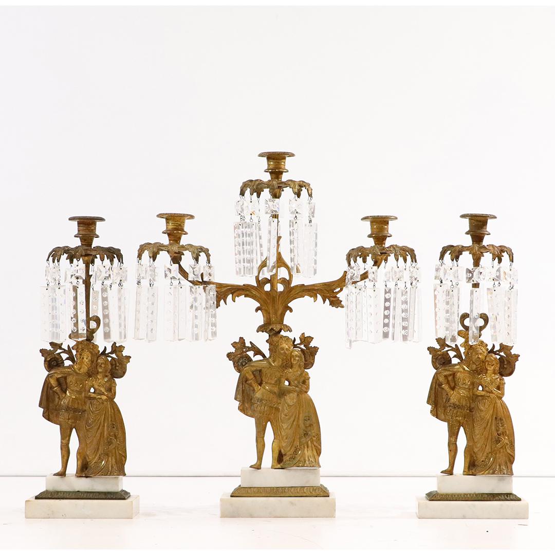 3 Pc 19th C. Bronze & Crystal Prisms Girandole Set: 3 Pc 19th C. Bronze & Crystal Prisms Girandole Set. Renaissance Man and Woman. Mounted on marble bases. Antique. All prisms intact. size: 15.5h x 5.5w, 19h x 14.5w