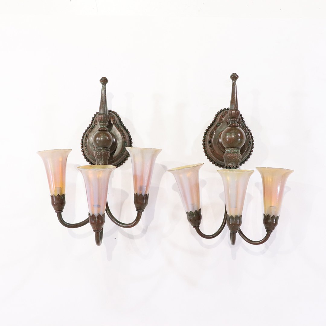 2 TIFFANY STUDIOS Bronze 3-Light Sconces Fully Signed: 2 TIFFANY STUDIOS Bronze 3-Light Sconces Fully Signed. Bronze wall sconces are signed: Tiffany Studios New York; all 6 lily iridescent shades are signed: L C Tiffany - Favrille. Good bronze patina fin