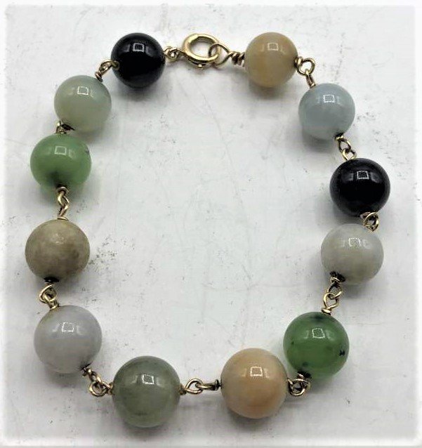 14 K Gold and Multi Color Jade Beads Bracelet: 14 K Gold and Multi Color Jade Beads Bracelet. size 8 in. length
