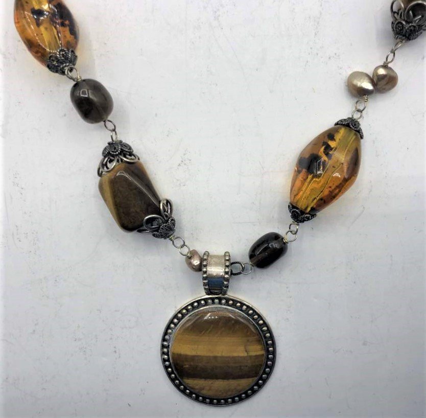 .925 Sterling Silver Tiger Eye Pendant, Assorted Stones: .925 Sterling Silver Tiger Eye Pendant, Assorted Stones necklace, amber, peridot, tiger eye, etc. size pendant 1.5 in. diameter; necklace 36 in. length