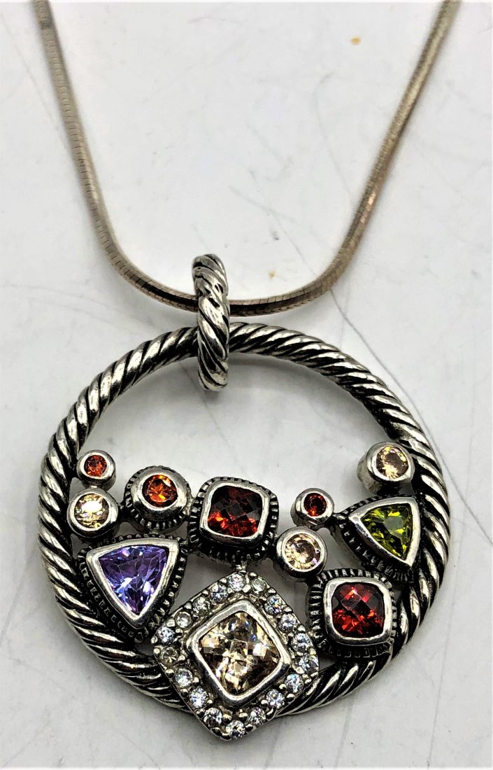 .925 Sterling Silver Pendant Necklace Multiple Stones: .925 Sterling Silver Pendant Necklace Multiple Stones: amethyst, citrine, peridot, ruby, CZs. size Pendant 1.25 in. diameter; chain 24 in. length