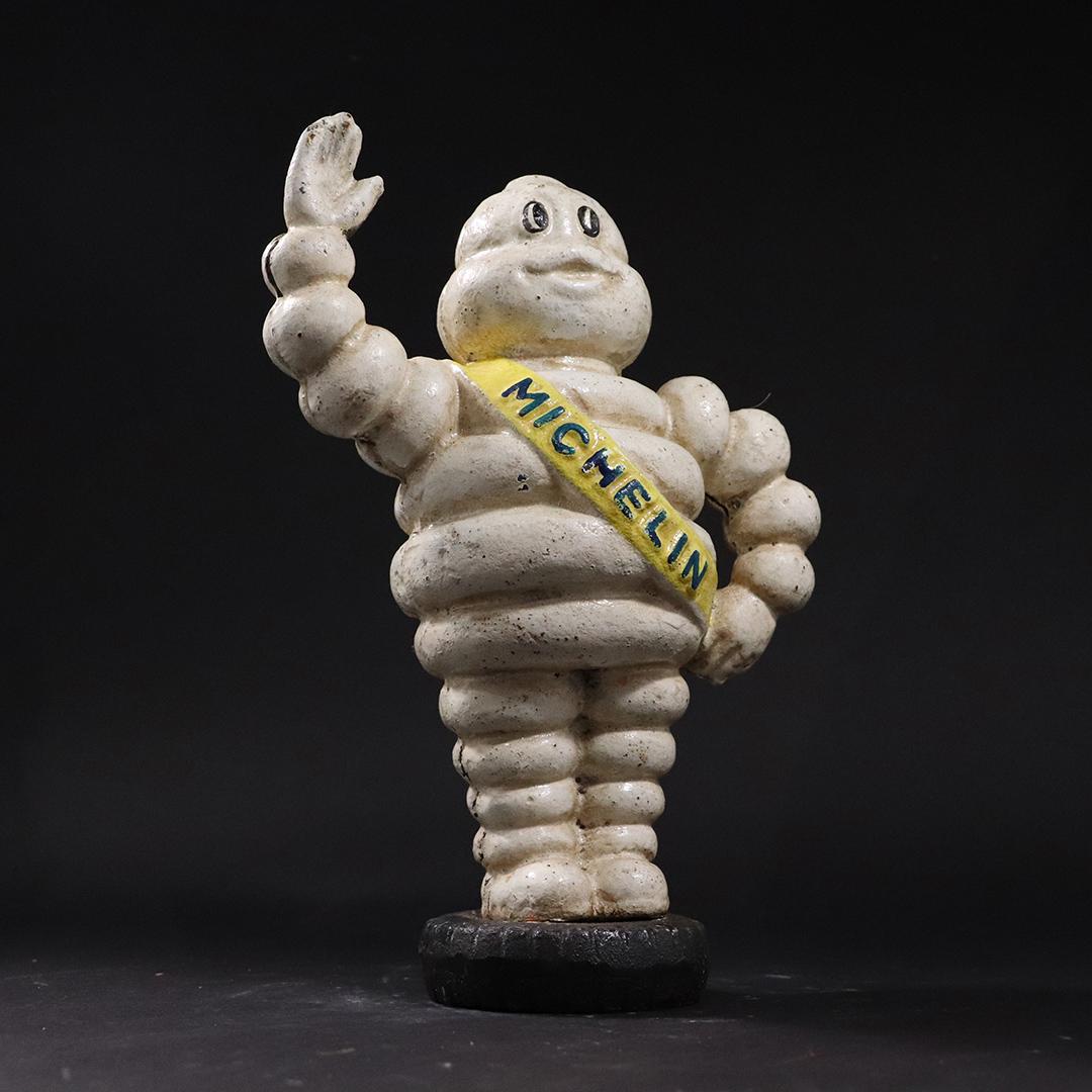 Michelin Man Cast Iron Figure Waving His Hand: Michelin Man Cast Iron Figure Waving His Hand. Original paint finish. size: 9.25h x 6w