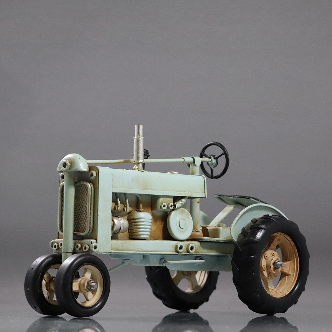 Green Tractor Model in Hard Composition: Green Tractor Model in Hard Composition resin. size: 6.75h x 10.5L