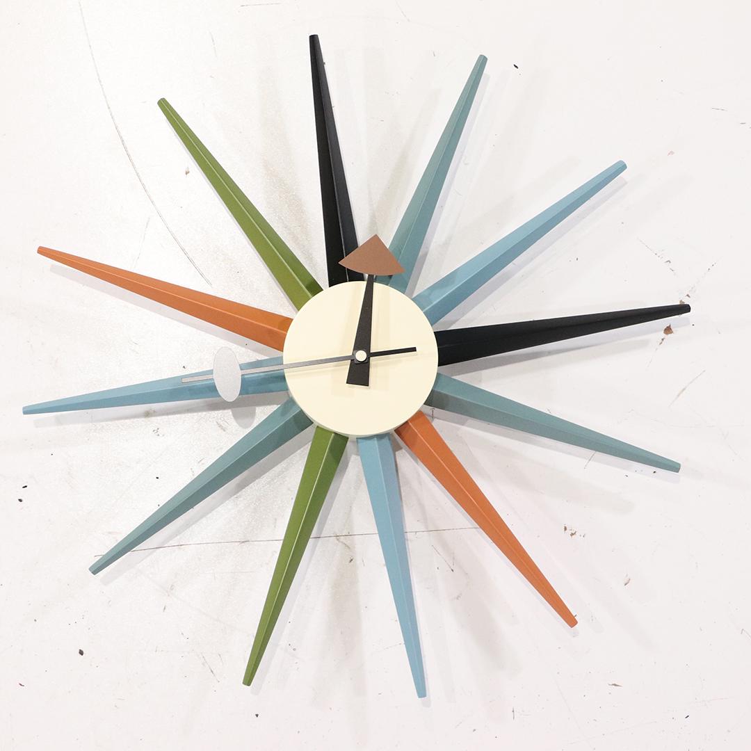 Style of George Nelson Multi Color Starburst Wall Clock: Style of George Nelson Multi Color Starburst Wall Clock, battery operated. Clean. 18.5 inches width