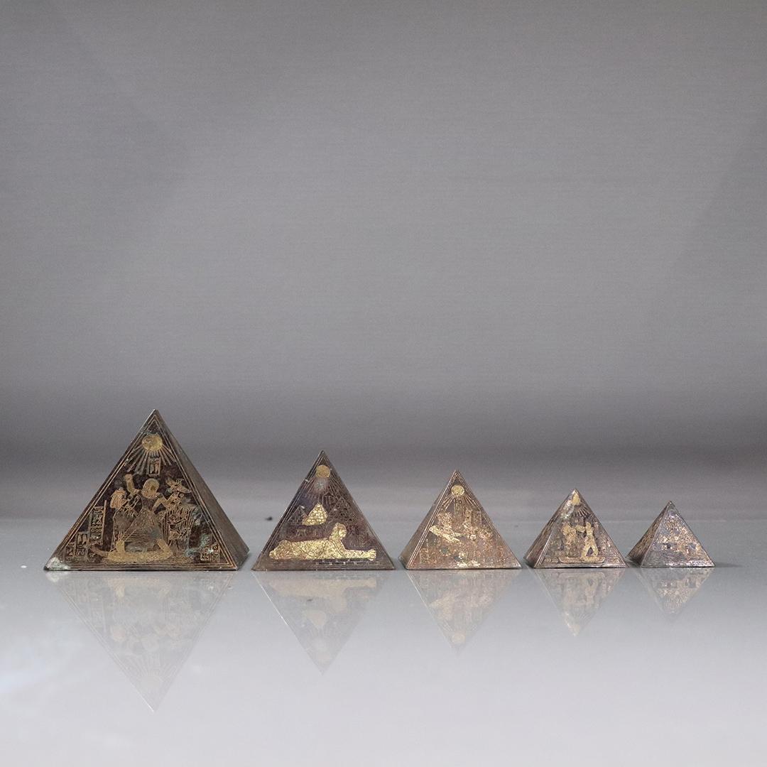 5 Graduated Sizes Brass Egyptian Incised Pyramids: 5 Graduated Sizes Brass Egyptian Incised Pyramids. size: 1-2.75h, 1.25-3.25w ranges