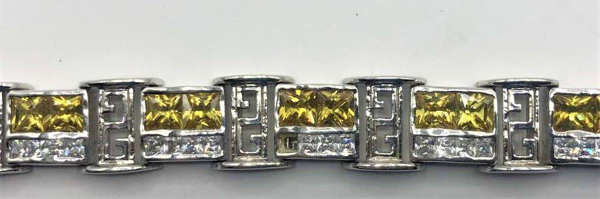 Exquisite .925 Sterling Yellow Sapphire and CZ Bracelet: Exquisite .925 Sterling Yellow Sapphire and CZ Bracelet. marked: .925 ; 12 links of yellow sapphires and CZs. Size: 9 in. length, 1/2 in. wide.