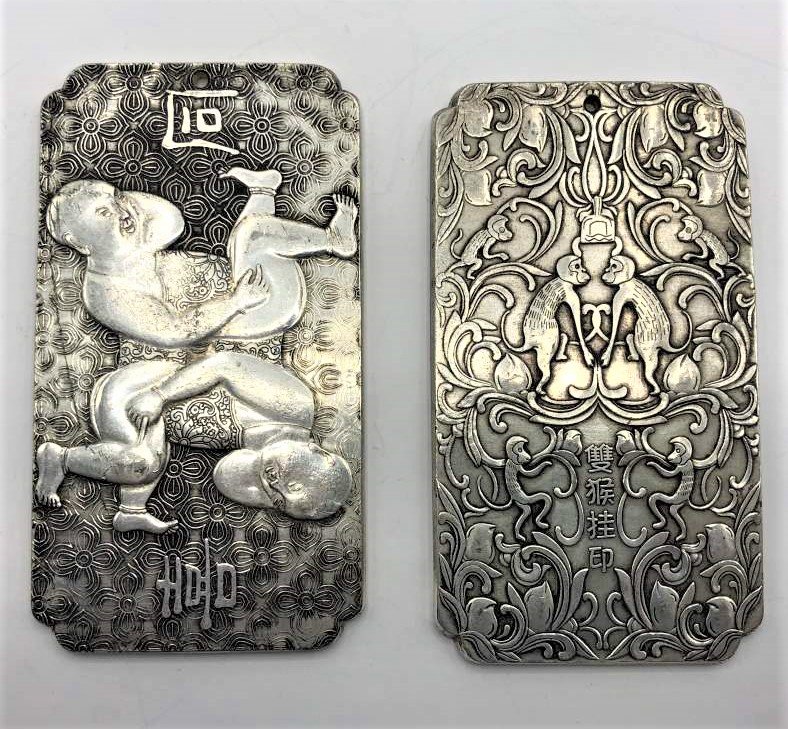 2 Heavy Gauge Silver Oriental Scenic Medallion Pendants: 2 Heavy Gauge Silver Oriental Scenic Medallion Pendants. Size: 4 in. x 2.25 in. Made of a Solid Low Grade Silver in testing. 2 Figues, 2 Monkeys. Signed.