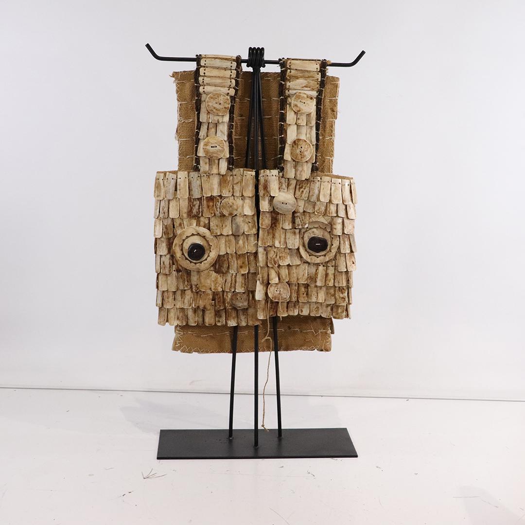 Unique Tribal Bone Breast Plate in Shape of an OWL: Unique Tribal Bone Breast Plate in Shape of an OWL. With custom made metal display stand. Size: 40h x 20w x 8d