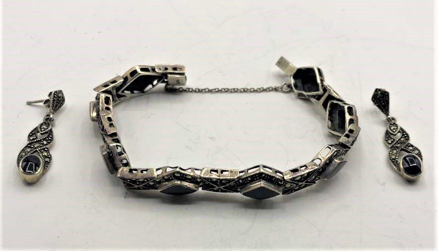 .925 Sterling Marcasites Black Onyx Bracelet & Earrings: .925 Sterling Marcasites Black Onyx Bracelet & Earrings. Size: bracelet 7 in. length, 1/2 in. wide; Earrings 1.5 in. x 3/8 in.