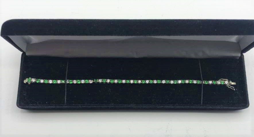 .925 Sterling Silver Emeralds and CZs Tennis Bracelet: .925 Sterling Silver Emeralds and CZs Tennis Bracelet. Size: 7.5 in. length x 1/4 in. wide