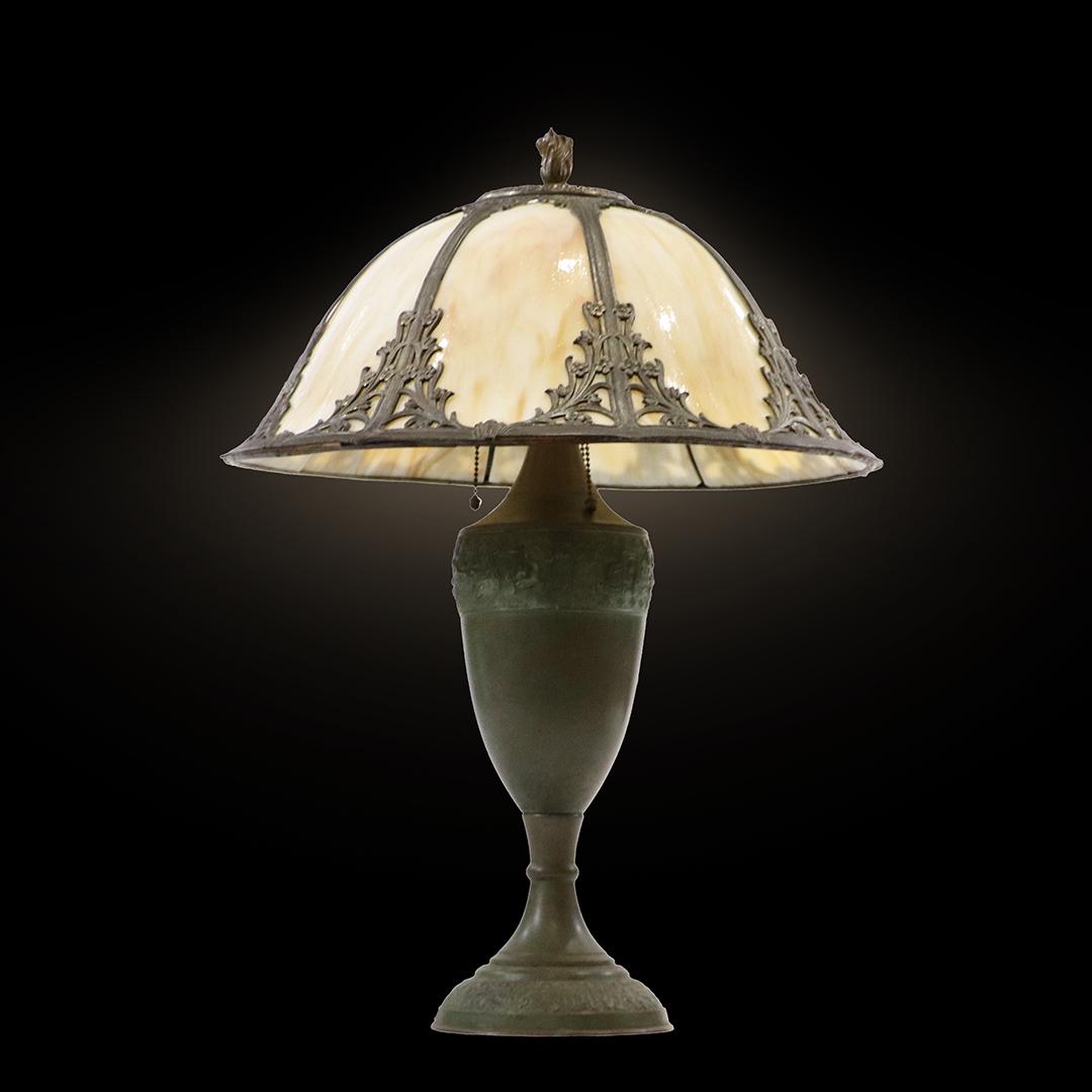 Quality Antique 6-Panel Caramel Slag Glass Table Lamp: Quality Antique 6-Panel Caramel Slag Glass Table Lamp, Shade is Curved Glass in Bell Shape Shade. Unsigned. Original patina finish. Wiring good. 3-Socket. Slag Glass panels are all good and original. 