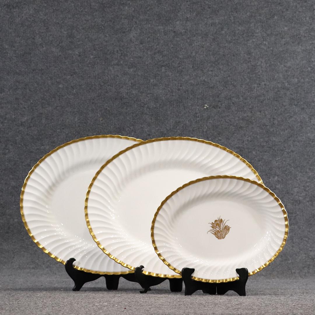 3 MINTON Gold Crocus Porcelain Platters Graduated Sizes: 3 MINTON Gold Crocus Porcelain Platters Graduated Sizes. White porcelain with gold decoration. size: 12.5L x 10w, 17.75L x 14w, 18L x 14.25w