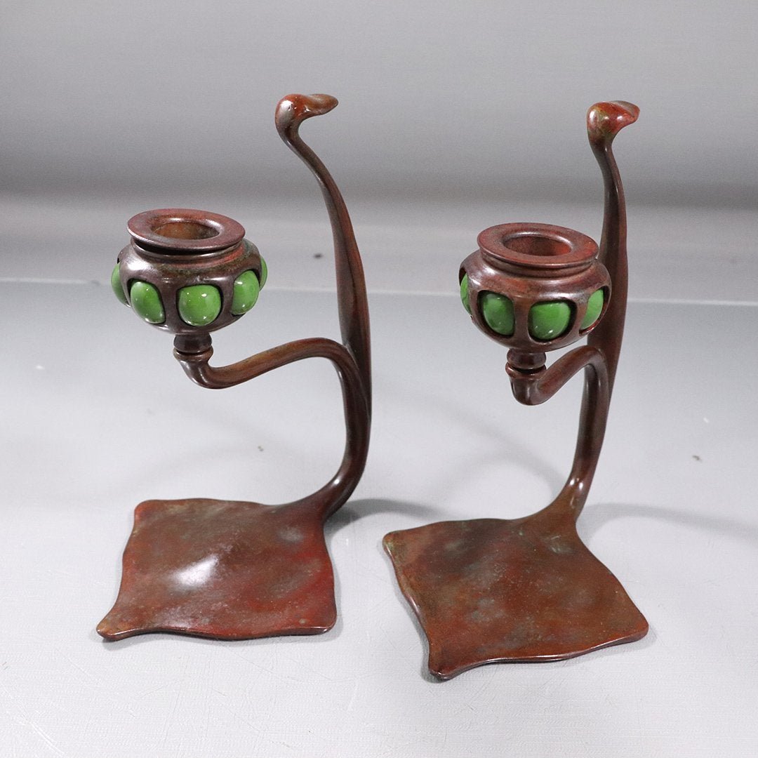 Pair TIFFANY STUDIOS NEW YORK #1203 Candlesticks: Pair TIFFANY STUDIOS NEW YORK #1203 Candlesticks with arts and crafts green blown glass accents. Good bronze patina finish. Signed on base: Tiffany Studios New York #1203. size: 7.5h x 6L x 4.75w