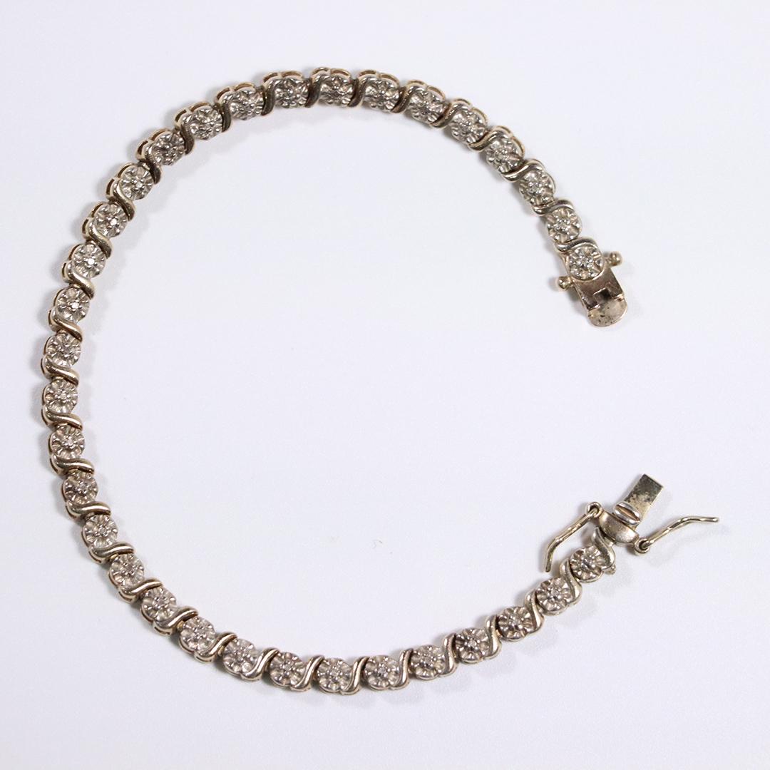 .925 Sterling Silver and Moissanites Tennis Bracelet: .925 Sterling Silver and Moissanites Tennis Bracelet. Size: 7 in. length