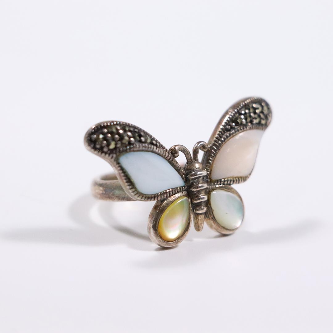 .925 Sterling Silver Butterfly Ring MOP & Marcasites: .925 Sterling Silver Butterfly Ring Mother Of Pearl & Marcasites . Ring size: 8 ; size: 1 3/8 in. x 3/4 in.