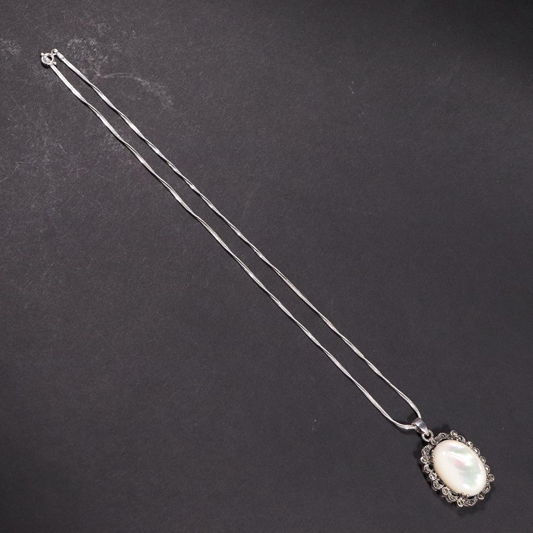 .925 Sterling Silver MOP Marcasites Pendant Necklace: .925 Sterling Silver MOP Marcasites Pendant Necklace. Size: pendant 1.5 in. x 1 in. ; .925 Sterling Silver chain 18 in. length
