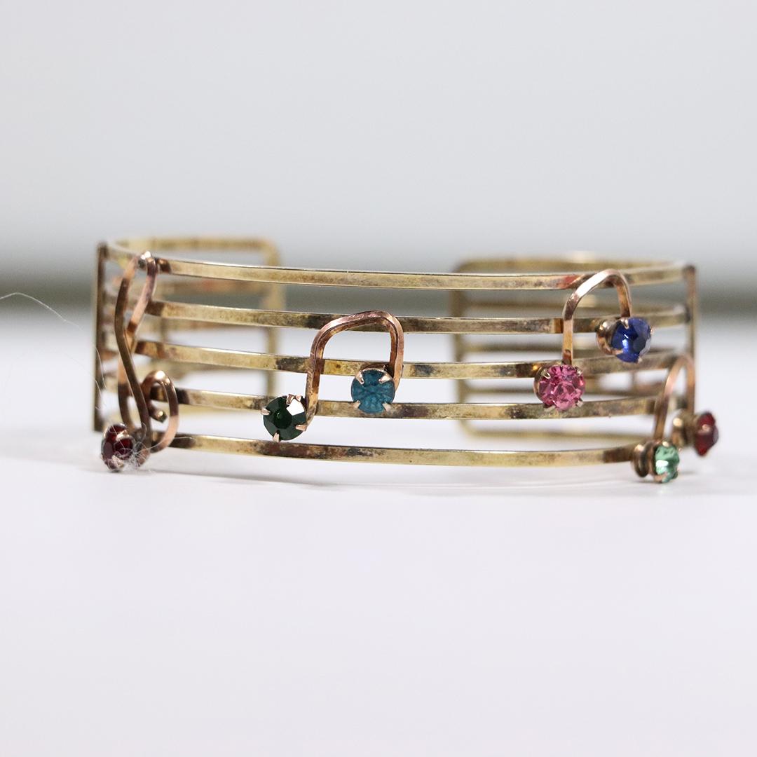 12K Gold Filled Harper Bracelet Music Notes Multi Color: 12K Gold Filled Harper Bracelet Music Notes Multi Color stones. Size: 2.75 in. x 3/4 in.