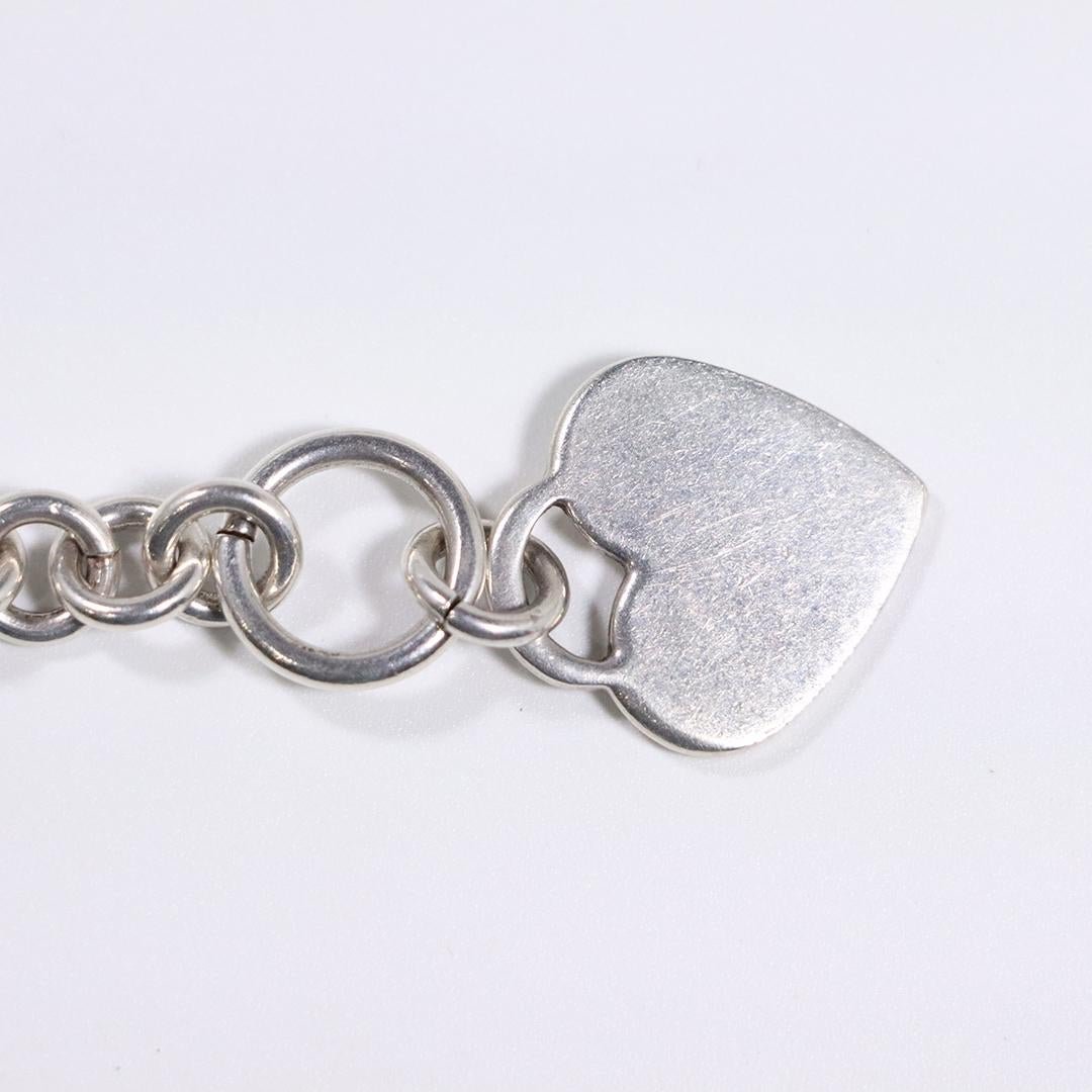 Sterling Silver Charm Bracelet with Sterling Heart: Sterling Silver Charm Bracelet with Sterling Heart. Size: 7 in. length x 1/4 in; heart 7/8 in. x 3/4 in.