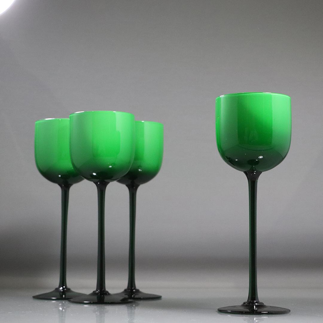 [4] Four Green Cased Glass Stem Wine Glasses: [4] Four Green Cased Glass Stem Wine Glasses. size: 9.25h x 3.25w