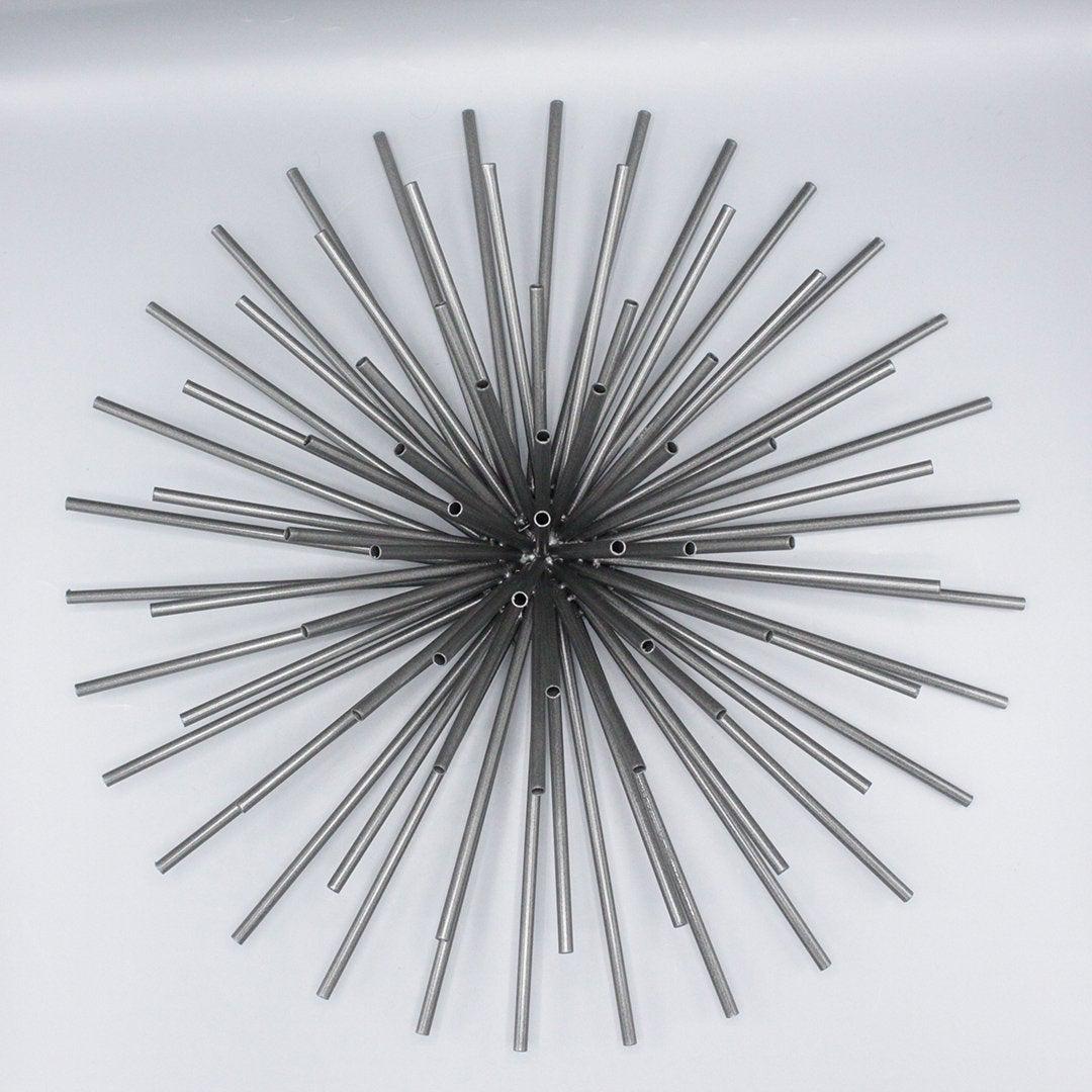 Mid-Century Metal Wall Sculpture Round Starburst Spray: Mid-Century Metal Wall Sculpture Round Starburst Spray in black. sunburst, sun ray Size: 20 inches in diameter