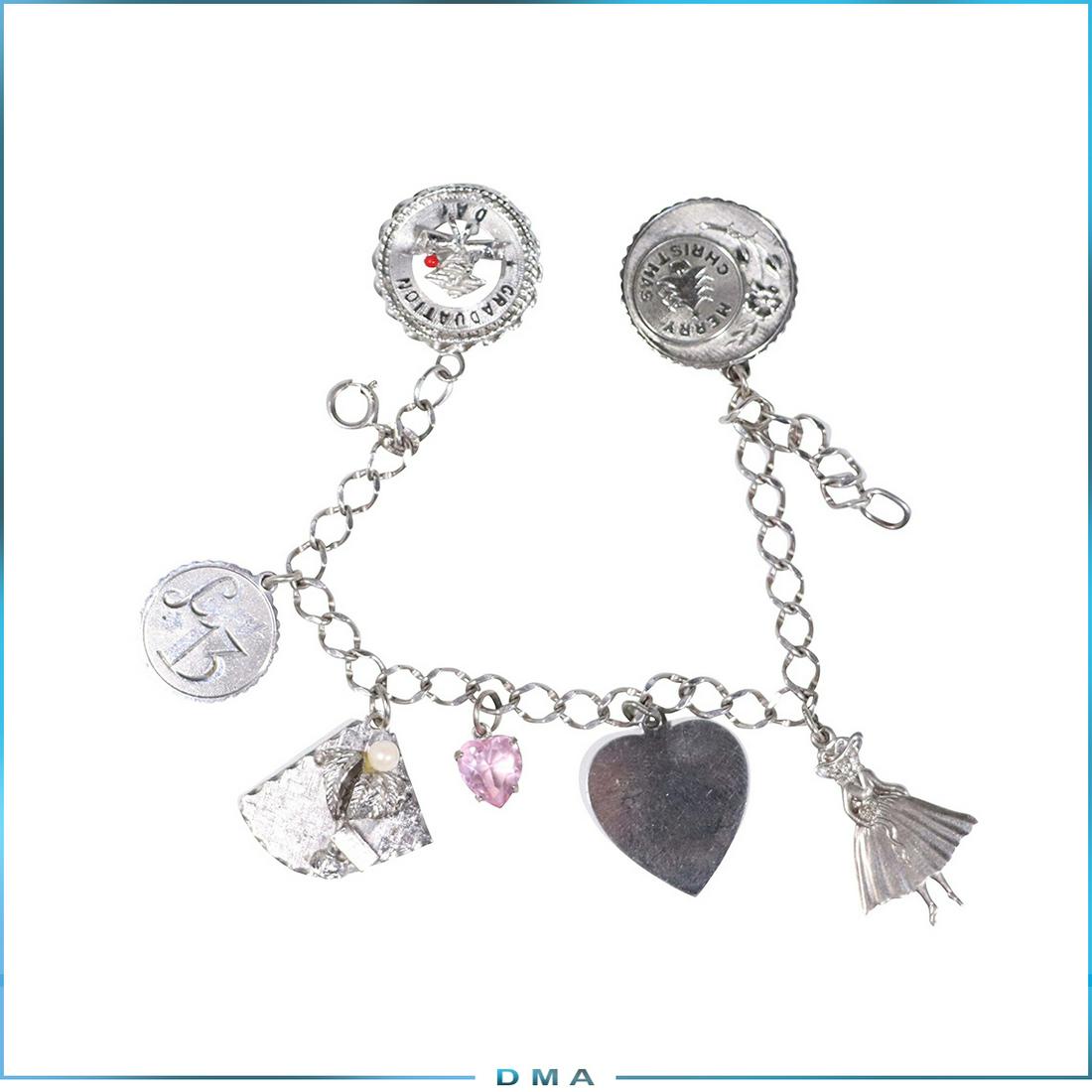 Sterling Silver Charm Bracelet 4 Charms Sterling, 2 10K: Sterling Silver Charm Bracelet 4 Charms Sterling, 2 Charms mot marked Test for 10K Gold. size: 7 in. Length