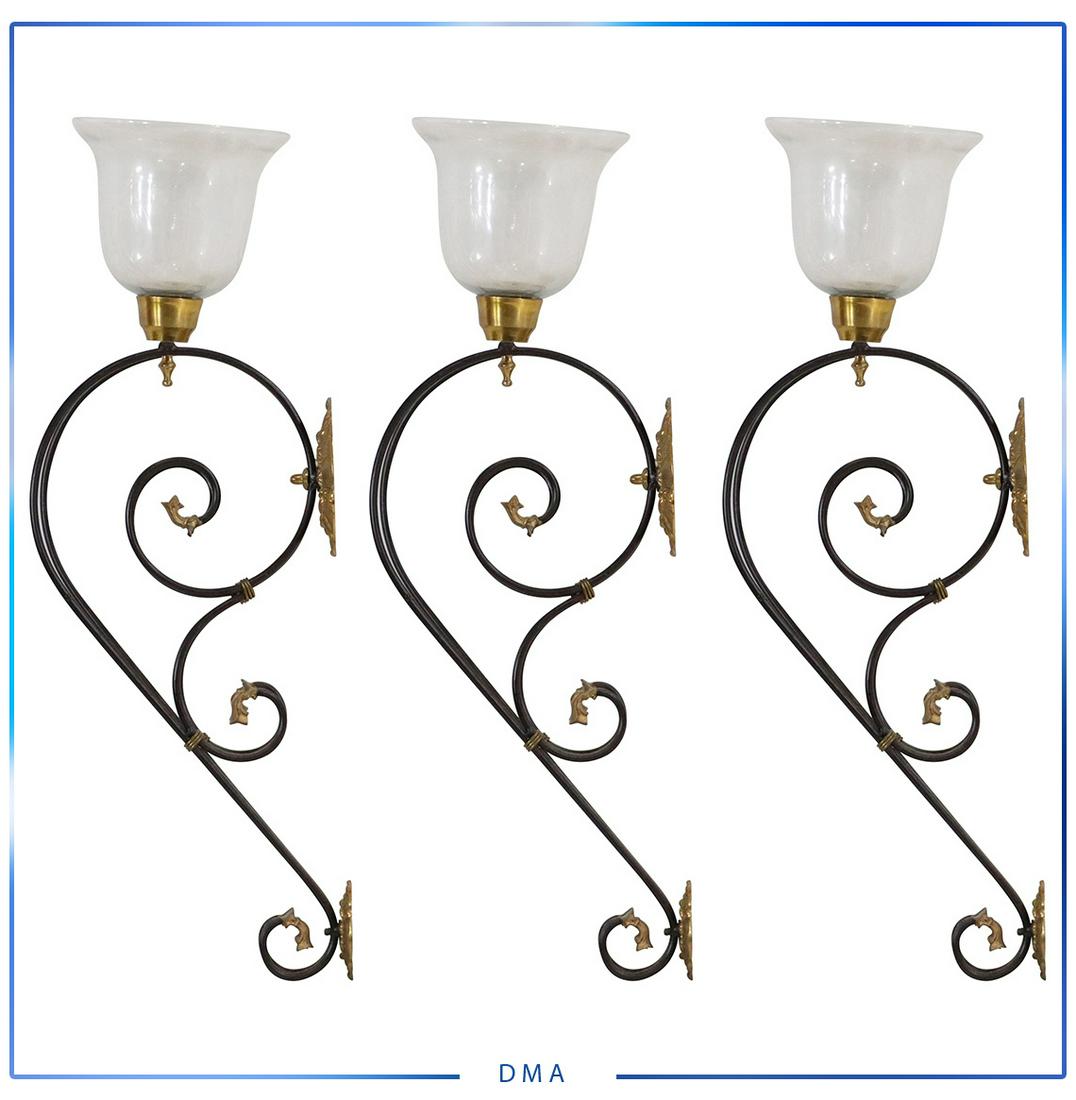 [3] Three Hollywood Regency Brass & Metal Wall Sconces: [3] Three Hollywood Regency Brass & Metal Wall Sconces with glass shades. size: 30h x 5.5l x 11w