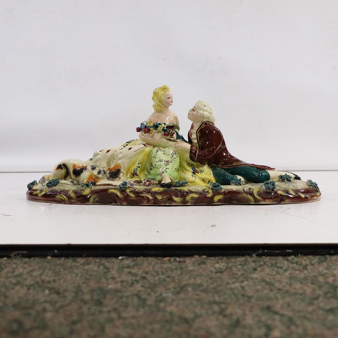 Italian Glazed Ceramic Courting Couple with Whippets: Italian Glazed Ceramic Courting Couple with Whippets. size: 8h x 21.5l x 9w