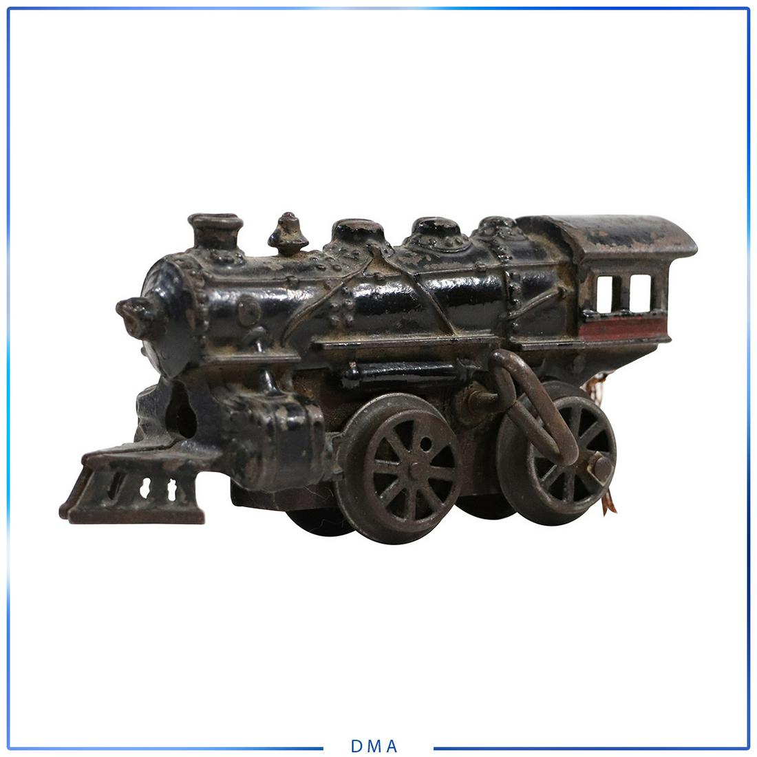 Vintage Cast Iron Wind-Up Toy Train Locomotive: Vintage Cast Iron Wind-Up Toy Train Locomotive. size: 3.5h x 6.5l