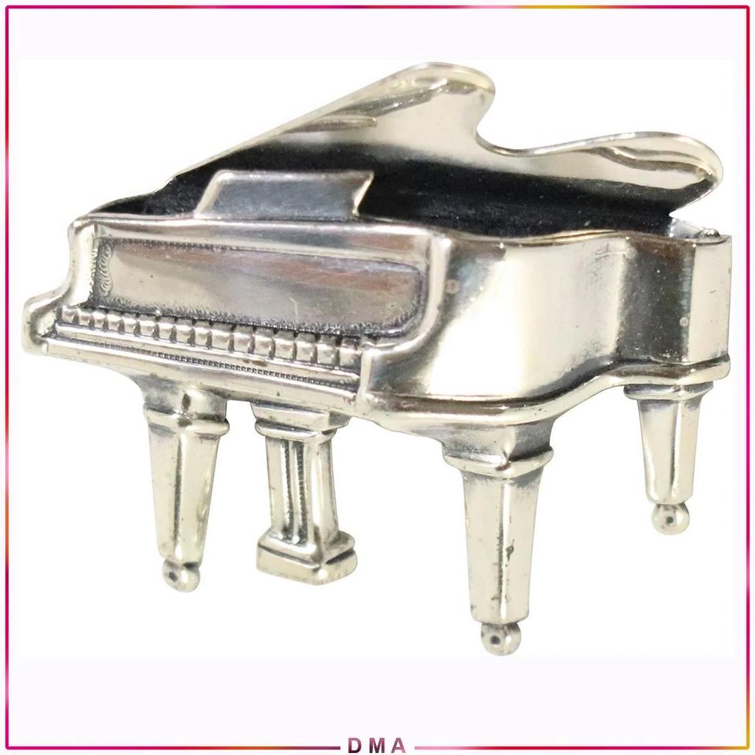 Sterling Silver Beau Baby Grand Piano Brooch: Sterling Silver Beau Baby Grand Piano Brooch. Marked: Sterling Beau. ; size: 1.25 in. x 1.25 in.