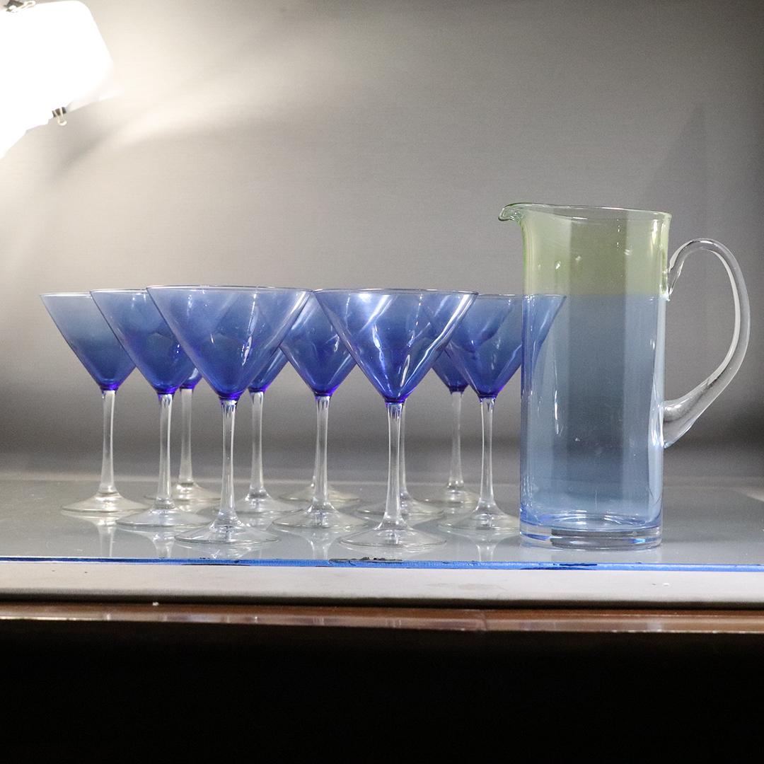 [10] Ten Blue Martini Glasses and Glass Pitcher: [10] Ten Blue Martini Glasses and Glass Pitcher. Size: 7.25h x 5w glasses, 9.75x7.5x4.5 pitcher