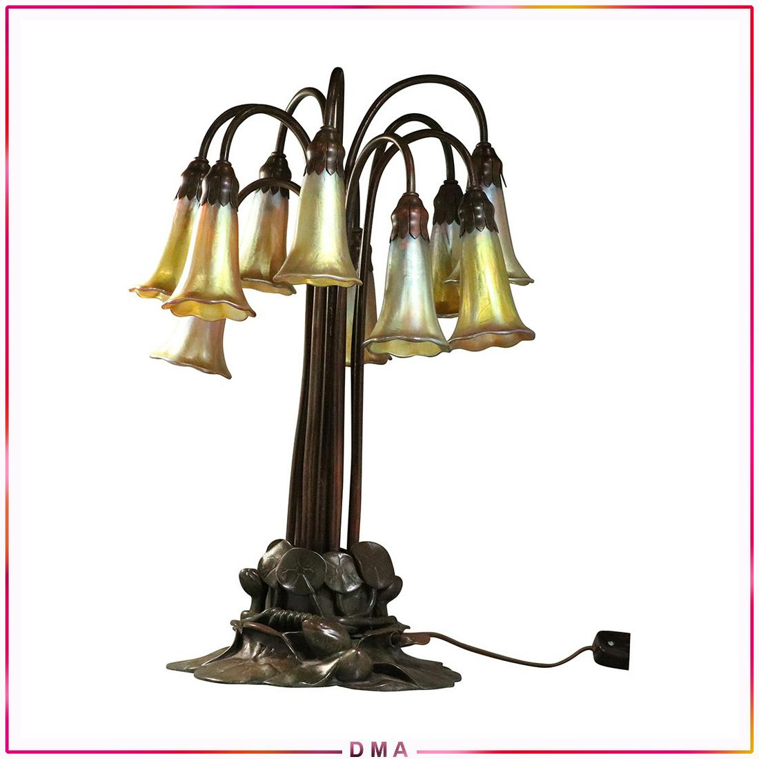 TIFFANY STUDIOS NEW YORK 10 Light Lily Lamp ALL SIGNED: TIFFANY STUDIOS NEW YORK 10 Light Lily Lamp ALL SIGNED. Bronze Base is Signed and Numbered: Tiffany Studios New York #381; ALL 10 ART GLASS SHADES ARE SIGNED: L.C.T. Favrile - All glass shades are goo