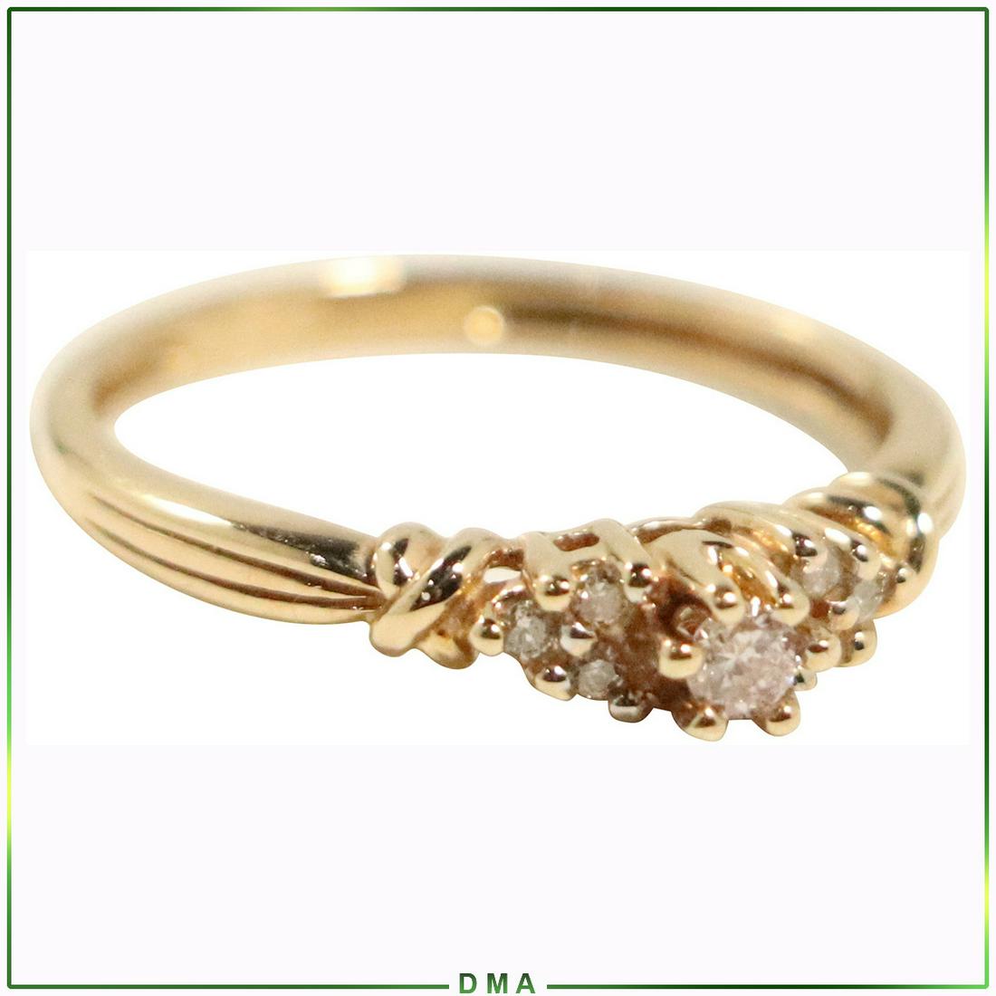 10K Yellow Gold Diamond Engagement Ring Size 7.25: 10K Yellow Gold Diamond Engagement Ring Size 7.25. Center diamond with smaller diamonds accenting the sides. Marked: 10K. size: 7.25