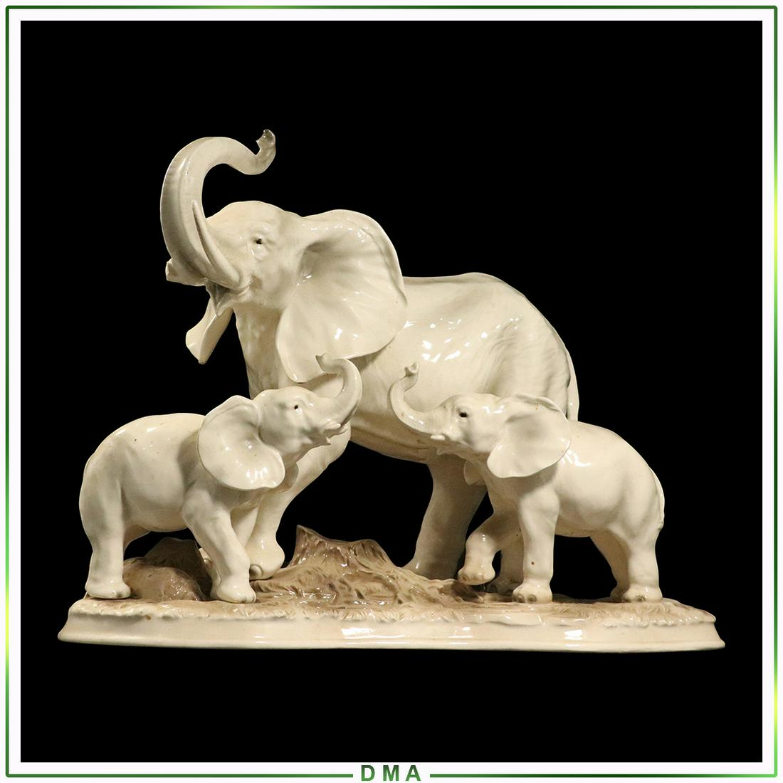 Capodimonte Porcelain Elephants Group Signed J Stewart: Capodimonte Porcelain Elephants Group Signed J Stewart. Note missing one tusk. Size: 13h x 17w