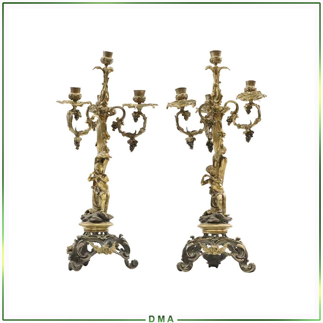 Pair 19th C. Italian Renaissance Bronze Candelabras: Pair 19th C. Italian Renaissance Bronze Candelabras with Putti Figure. Original Patina Finish. Size: 21h x 9w
