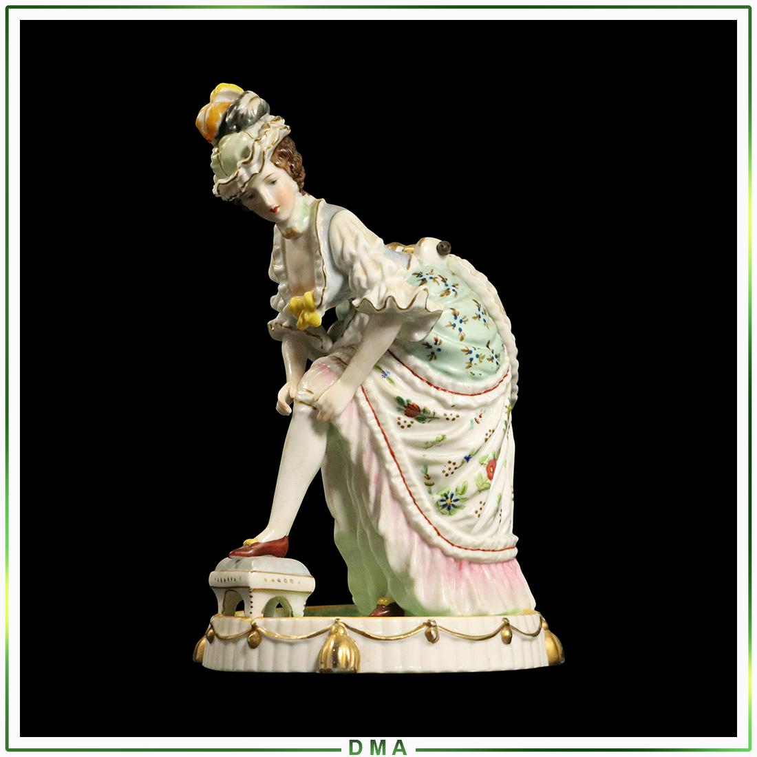 Capodimonte Porcelain Woman Pulling Up Stocking Planter: Capodimonte Porcelain Woman Pulling Up Stocking Planter. Size: 7.5h x 4.5w