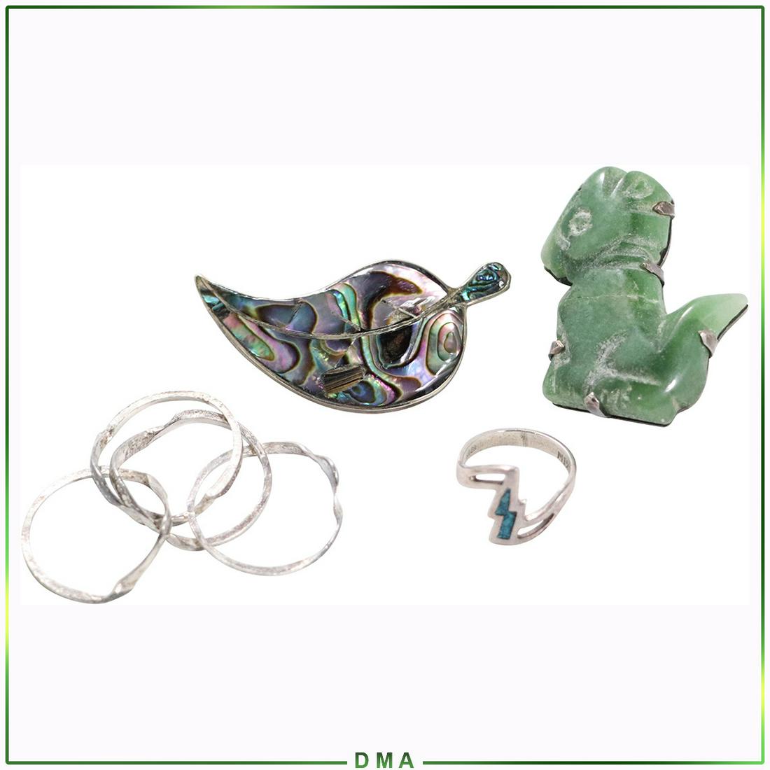 Assorted .925 Mexico Sterling Silver 2 Brooches 2 Rings: Assorted .925 Mexico Sterling Silver 2 Brooches 2 Rings. Tests Sterling and Jade Animal Brooch 1 3/4 in. x 1 1/2 in. marked Mexico; Alpaca Mexico Abalone Brooch ; 4-Babds Ring Size 8 marked .925 ; Ste