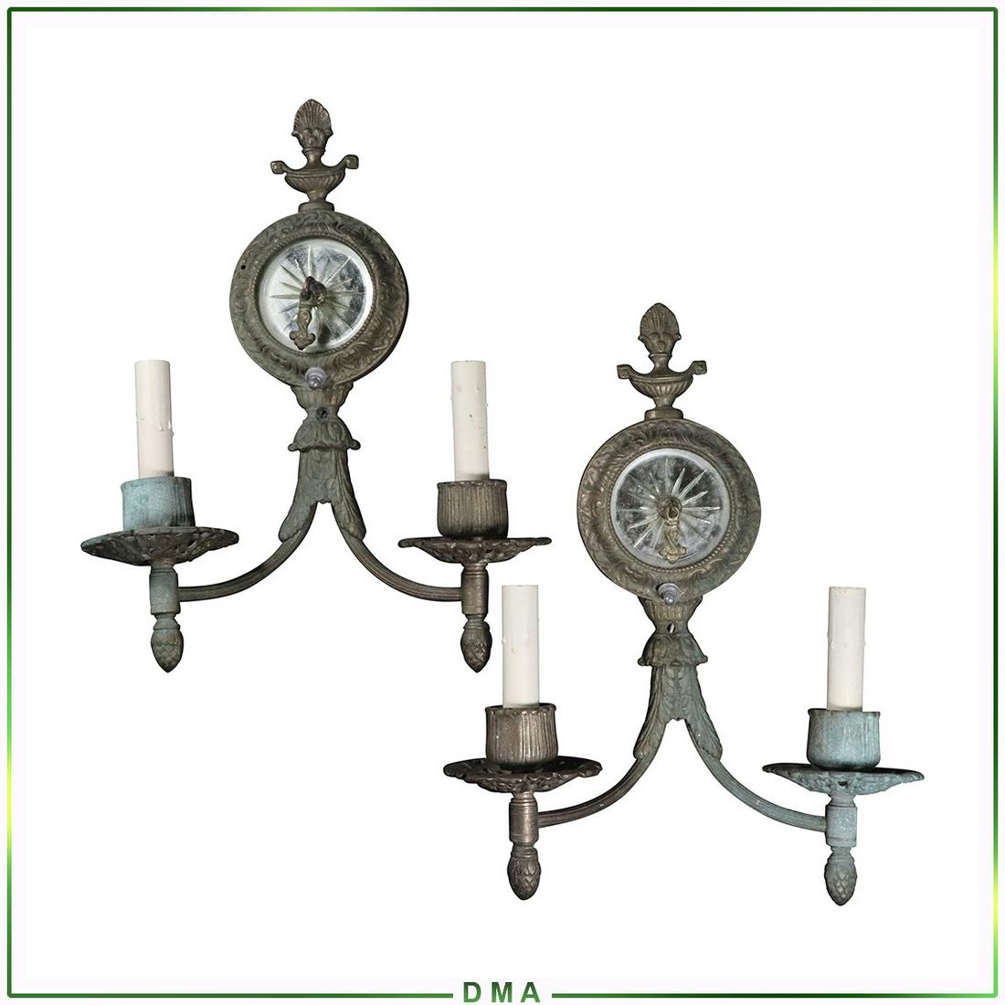 2 Antique Bronze French Empire Two Light Wall Sconces: 2 Antique Bronze French Empire Two Light Wall Sconces, with mirrored rosette center. Size: 14.5h x 11w