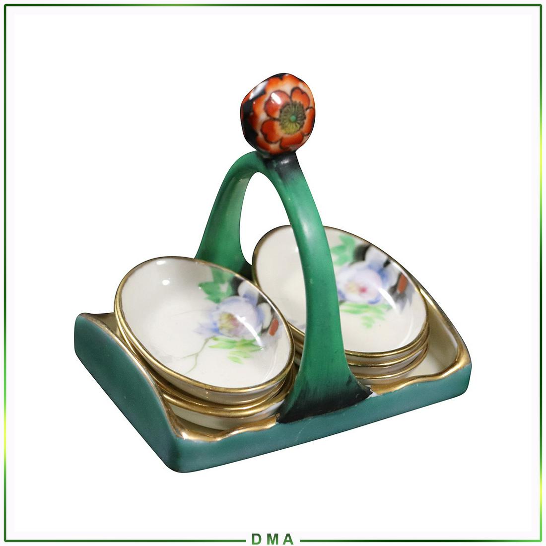 Noritake Porcelain Salt Dishes in Porcelain Caddy: Noritake Porcelain Salt Dishes in Porcelain Caddy. Vintage. Size: 3.5h x 3.5w caddy, 2.5L x 1.5w bowls