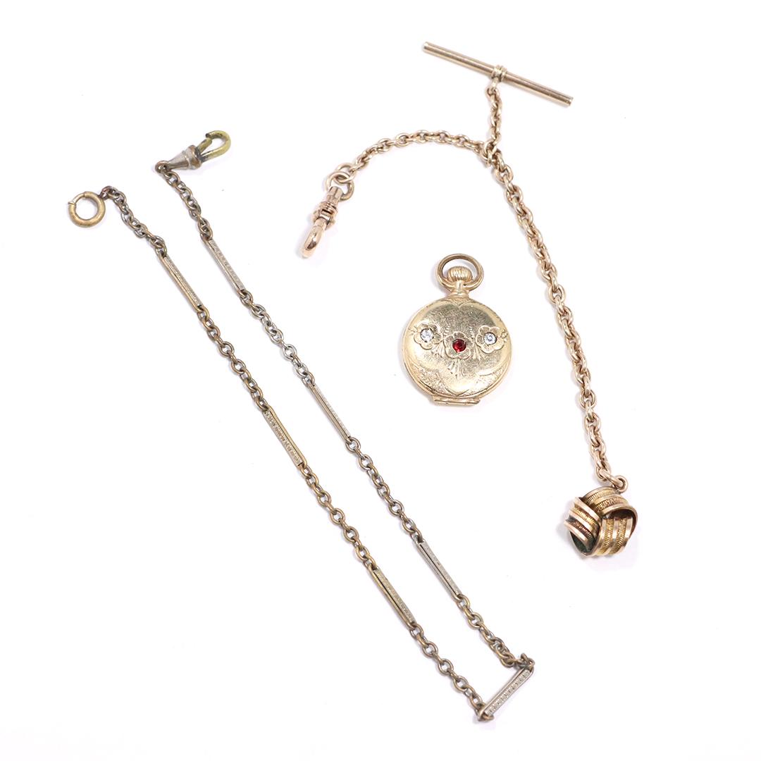 2 Victorian Watch Fobs one tests 10K & Victorian Locket: 2 Victorian Watch Fobs one tests 10K & Victorian Locket. size 10K fob 6 in. x 5/8 in. ; watch fob 13 in. ; locket 7/8 in/ diameter.